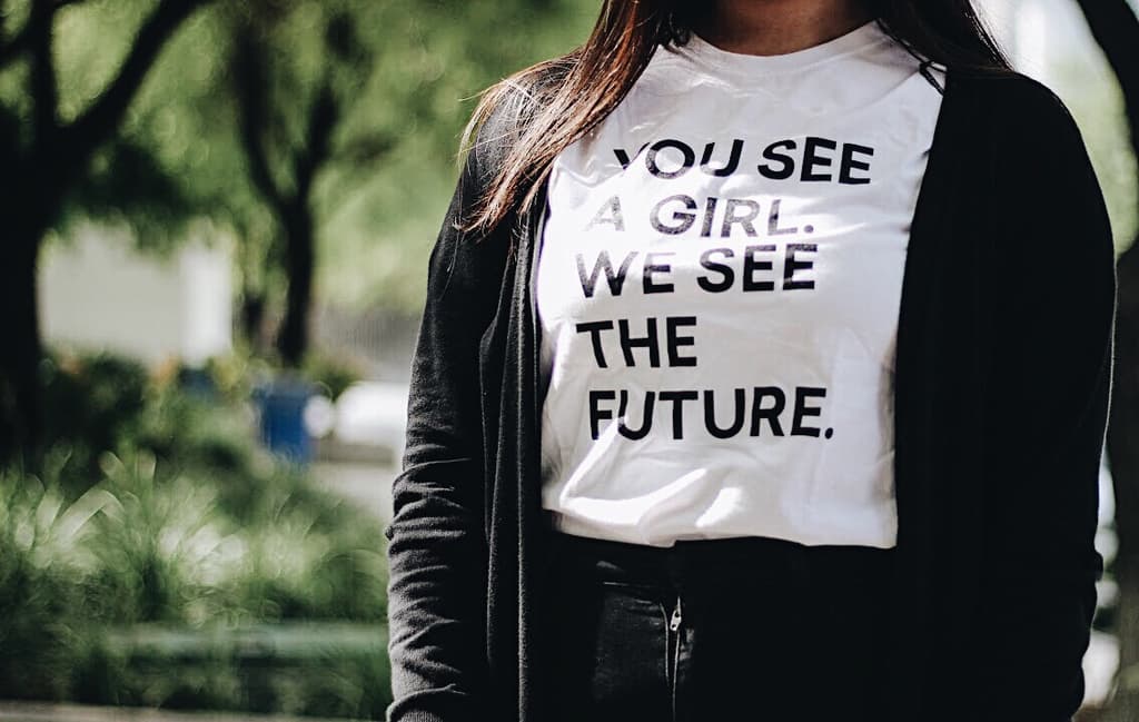 T-shirt featuring 'You see a girl. Wee see the future'