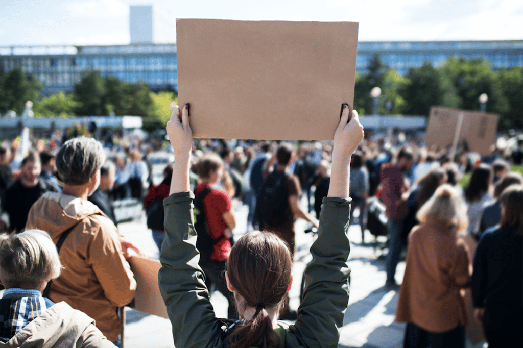 Woman holding a sign at a protest