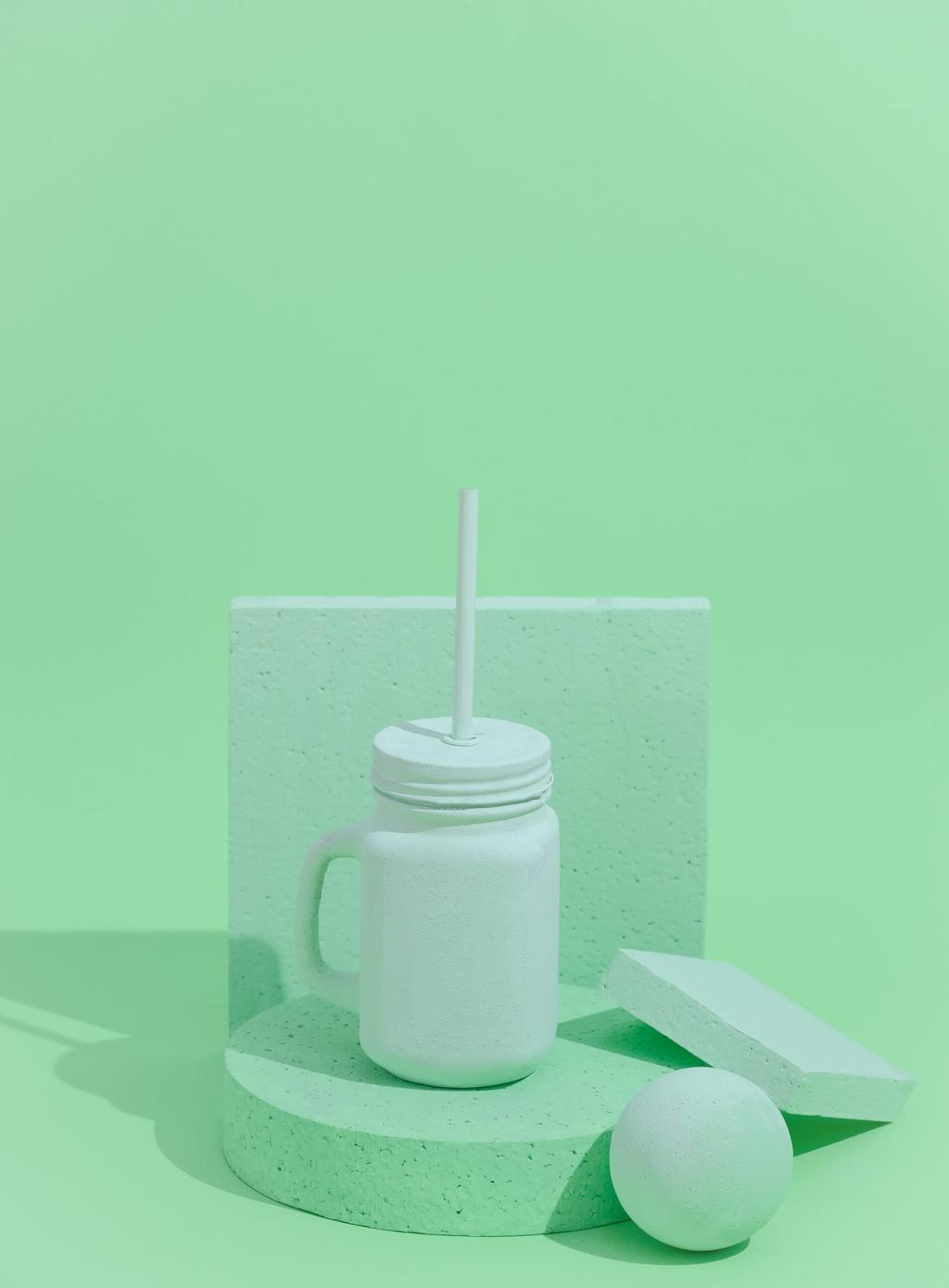Minimal aesthetic still life monochrome design. Aqua Menthe trends.  Smoothie mug and abstraction