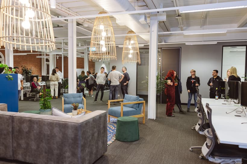 Envato employees gathered at our recent housewarming event in some of the open space collaboration areas. 