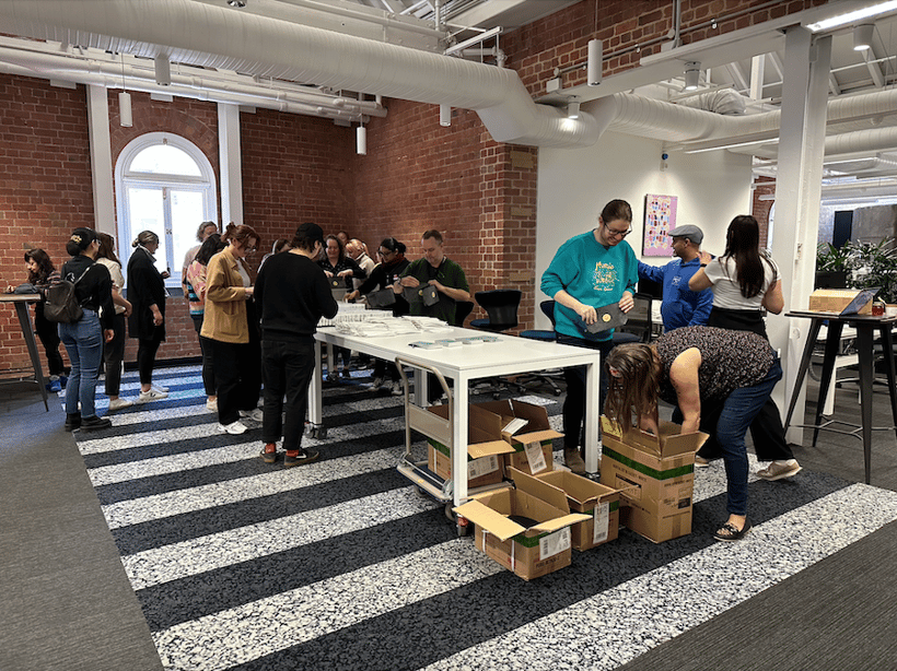 Envato employees making care packages for our new day box volunteer activity